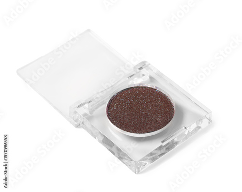 Jar of brown glitter on whi...