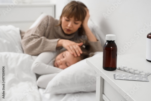 Cough syrup with pills on t...
