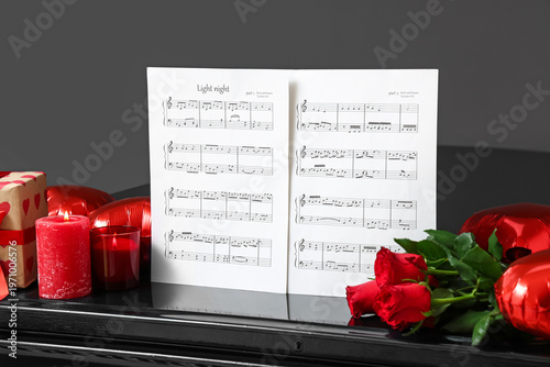 Piano with note sheets, ros...