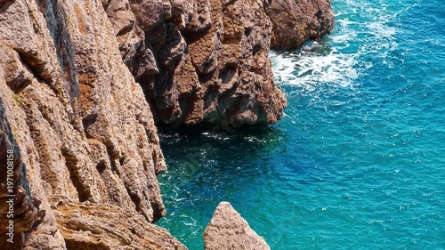 rocky coast of Adriatic Sea, against backdrop of blue water, abstract background of summer travel and vacation
