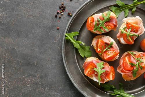 Tasty canapes with jamon, c...