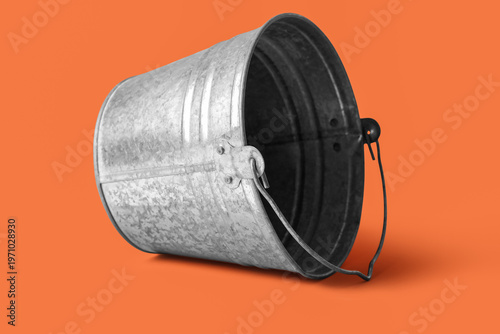 Galvanized bucket on orange...