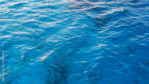 Billede på lærred Blue abstract blue water surface with clear pool, ocean-like waves, ripples and