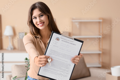 Young woman with house rent...