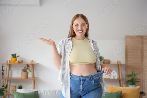 Young happy woman in loose ...