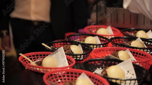 Close-up of a chef’s hands preparing meat bao buns
