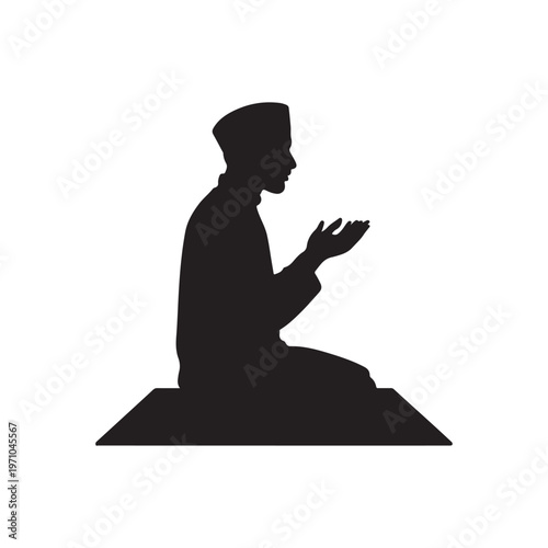 Silhouette of a Muslim man in traditional clothing praying on a prayer mat with hands clasped in supplication