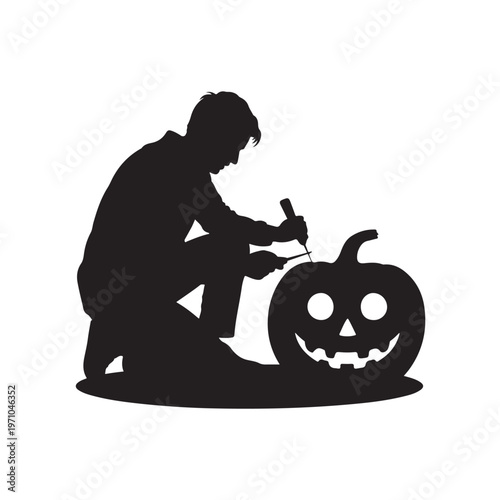 Silhouette of a person kneeling and carving a smiling jack-o-lantern pumpkin with a tool on a white background