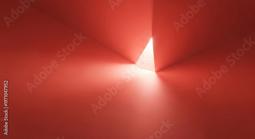 Glowing triangular opening in minimalist red abstract wall, dramatic light