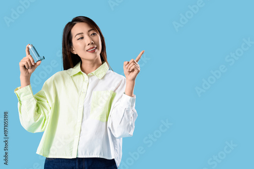 Happy young Asian woman wit...