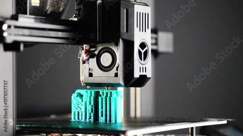The 3D printer prints a plastic part in clear, short bursts. High quality 4k footage