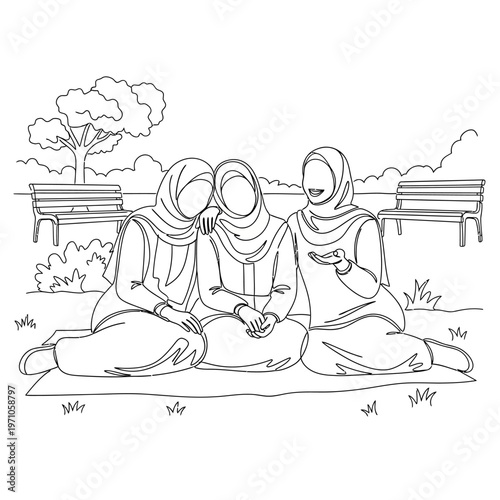 Three women wearing headscarves sitting.