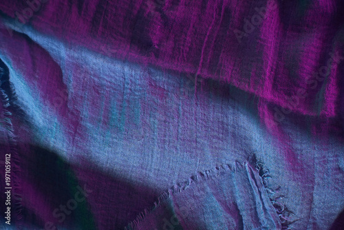 Soft blue fabric draped on a flat surface showing texture and details in natural light during daytime