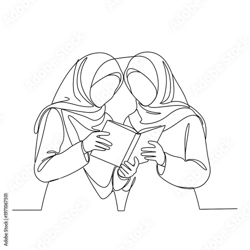 Two women reading a book together.