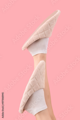 Female legs in soft slipper...