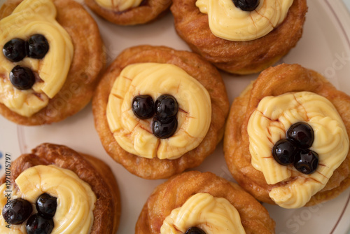 An overhead shot of Zeppole di San Giuseppe served on a plate.
