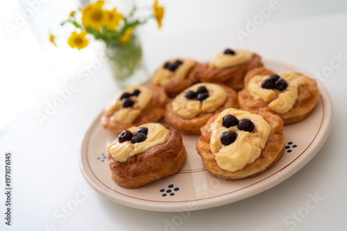 Zeppole di San Giuseppe. A traditional Italian pastry filled with custard and topped with black cherries, typically served on Father's Day. Traditional pastry.