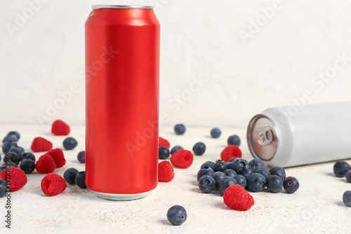Cans of fresh soda and berr...