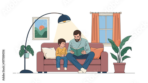 Father sitting on comfortable brown sofa reading a green book to his young son in a cozy well lit living room.