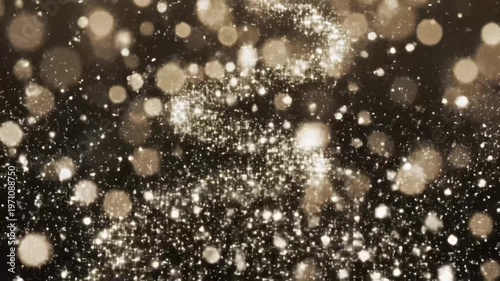 Golden glittering particles and light flares abstract background