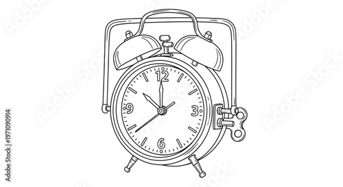 An alarm clock with a bell on top is sitting on a surface.