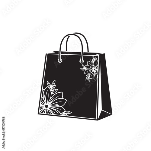 A black shopping bag with elegant white floral designs adorning the bottom left and top right corners, featuring sturdy handles and a crisp outline.