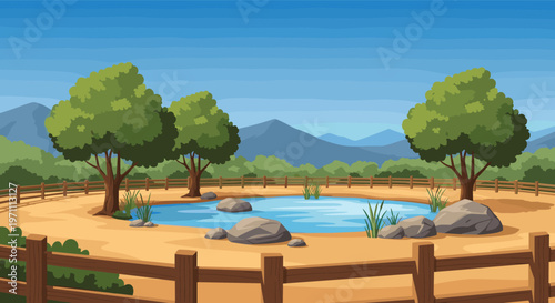 Empty safari animal enclosure featuring a clear blue pond, grey rocks, and green trees behind a wooden fence.