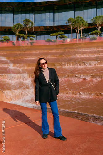 A young girl walks in the park in the summer