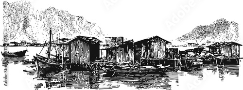 fishing boats docked beside rustic wooden houses with mountains in the background by the water
