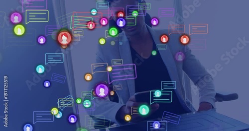 Noticing floating icons rising, Indian man tapping phone to check messages at desk in light blazer