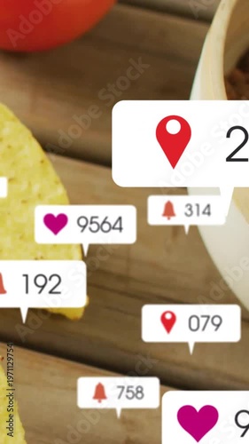 Vertical video: Shot panning right sparking likes over cheese chip tomato on wood boosting food ads