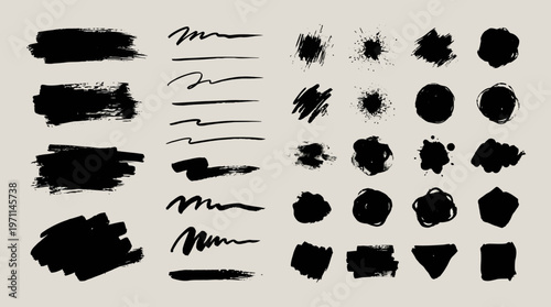 Collection of black ink brush strokes and shapes.