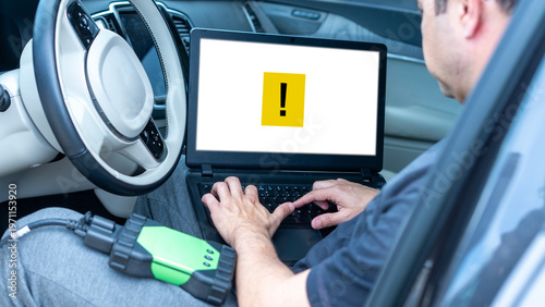 mechanic man at auto service using check up device