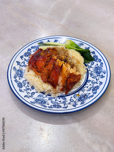dark soy sauce roasted chicken with oil rice with vegetables cucumber in plate on white marble table dim sum halal food breakfast menu for china Hong Kong cafe