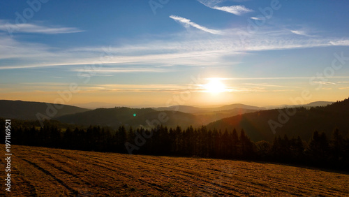 Drone flight over sunrise, mountains, forest, USA, America