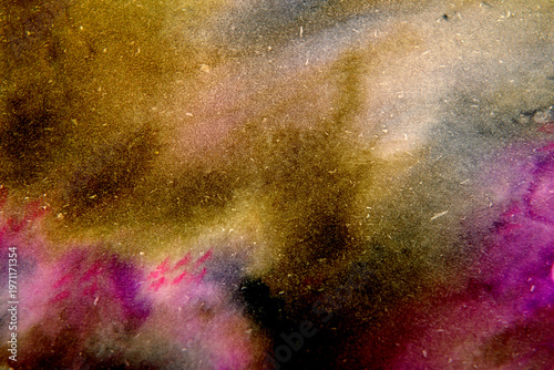 Bright background of multi-colored stains on paper