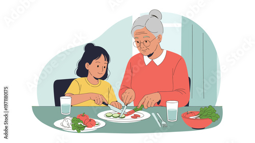 Caring grandmother and her young granddaughter sitting at a table and enjoying a healthy meal with fresh vegetables.