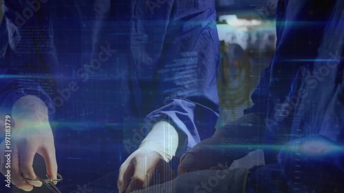 Animation of digital interface over surgeons in operating theatre