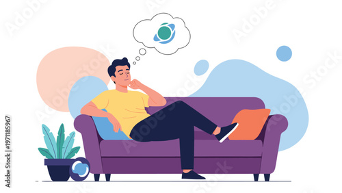 Young man sitting on a purple sofa and thinking about global connections or travel indicated by a thought bubble icon.