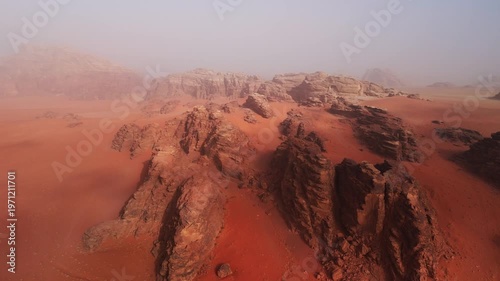 Wallpaper Mural Wide drone over big red rocky mountains in mist in wadi rum desert in jordan Torontodigital.ca