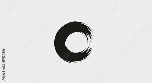 Black ink brush circle on a gray background, abstract art, zen symbol