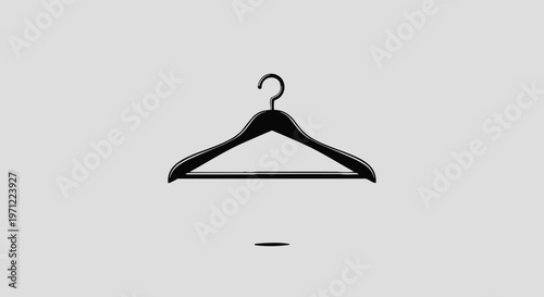 Minimalist representation of a black wooden coat hanger on a neutral gray background
