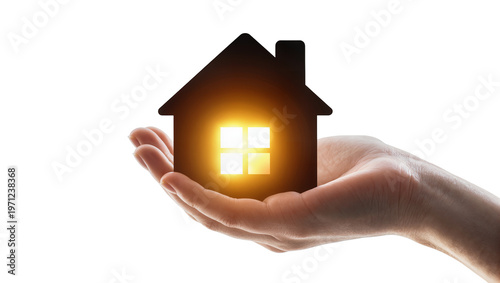 Glowing miniature house model held gently by a fair human hand, representing homeownership