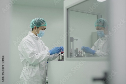 female doctor looking at a microscope