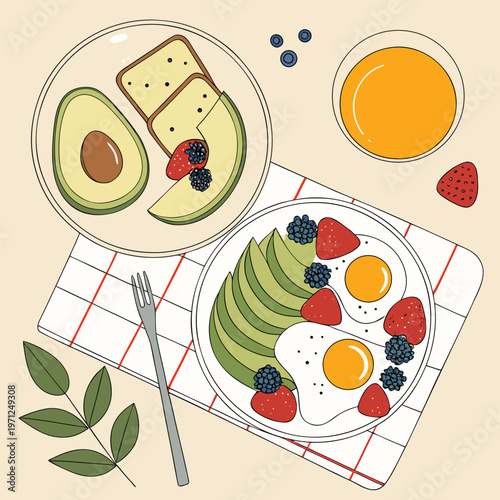 Nutritious breakfast with eggs, avocado, berries, and juice, fried eggs