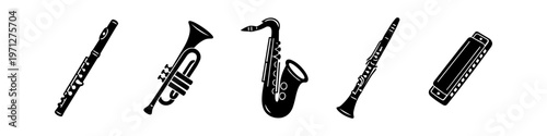 Set of black minimalist silhouettes of wind instruments including flute, trumpet, saxophone, clarinet, and harmonica on a white background. Ideal for music-related graphic design projects.