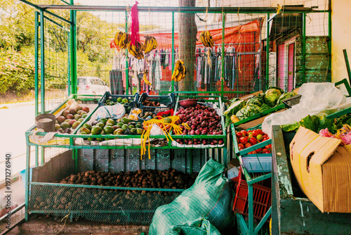 Vibrant Fresh Produce vendor Stall at a roadside with avocados, bananas, potatoes and other produce in Nairobi, Kenya
