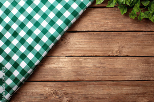 Rustic Wooden Background with Green Gingham Cloth and Greenery