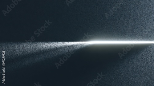 Minimalist light beam on dark textured wall, dramatic ray of light across navy blue surface, cinematic shadow and highlight contrast