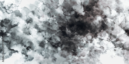 A bright blue sky with white clouds hangs over a dark storm of snow in the mountains and forest where light and fog create an abstract texture of nature